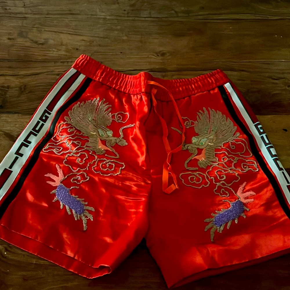 Beautiful Gucci shorts. Embroidered with gold dragon.